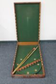 An antique mahogany folding bar billiards table