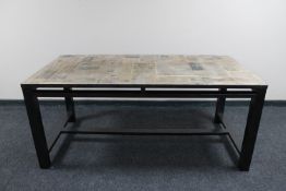 A contemporary dining table with 'newspaper' top