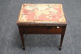 An Edwardian mahogany piano stool