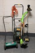 A petrol strimmer, push mower,