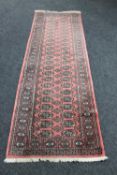 A Baluchi style runner on pink ground
