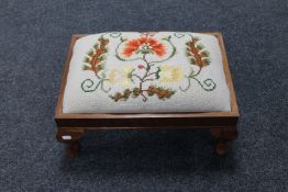 A mahogany tapestry footstool