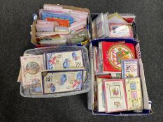 Four boxes containing a large quantity of greetings cards