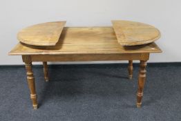 A pine flap ended dining table