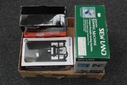 A boxed Soland compact portable sewing machine,