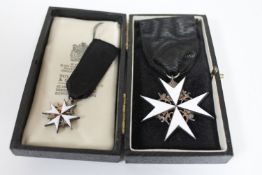 A white enamel medal with miniature on black ribbon in Toye, Kenning & Spencer case.