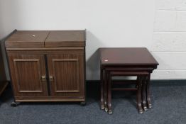 A Philips hostess trolley and a nest of tables on brass capped feet