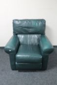 A turquoise leather armchair