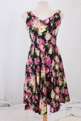 A box of twenty-four vintage flower v-neck dresses,