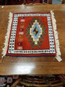 A fringed Caucasian mat,