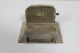 A silver desk calendar,