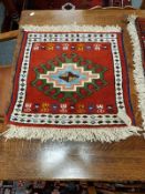 A fringed Caucasian mat,