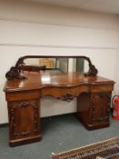 A Victorian mahogany mirror backed serpentine fronted twin pedestal sideboard, width 197 cm.