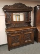 A Victorian heavily carved oak mirror backed sideboard, width 150 cm.