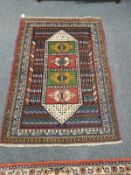 A Caucasian rug on polychrome ground,