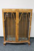 A 1930's walnut double door display cabinet