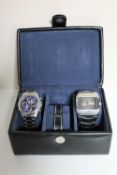 A leather box containing two gent's stainless steel Sekonda wristwatches
