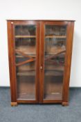 An Edwardian mahogany double door bookcase