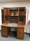 An Edwardian oak twin pedestal desk by Sopwith & Co Newcastle upon Tyne, width 142 cm.