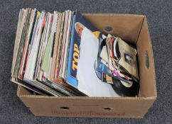 A box of vinyl LP records and 7