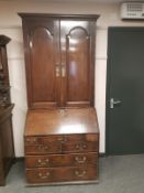 A George III oak bureau bookcase, width 93 cm.