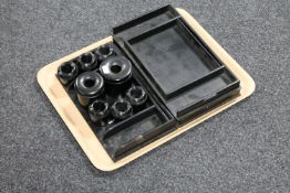 Three ebonised desk stands together with eight ebonised ink wells