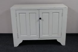 A painted antique pine double door cupboard