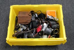 A box of vintage cameras