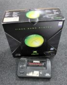 A boxed Xbox games console and a Sega Master System II games console