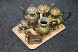 A tray of brass coffee and teapots,