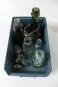 A box of eleven antique and later bottles and two part clay pipes