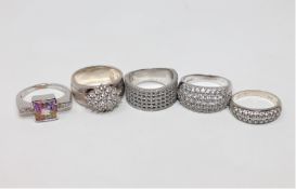 Five silver dress rings
