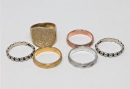 Six silver dress rings