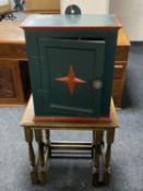 A nest of two oak tables together with a painted wall cabinet