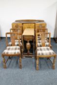 A six piece 1930's oak dining room suite comprising of sideboard,