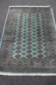 A Bokhara rug on mint ground,