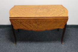 A French inlaid Kingwood coffee table with ormolu mounts
