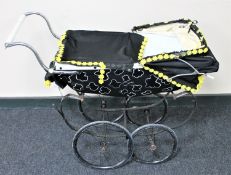 A mid 20th century Silver Cross coach built pram