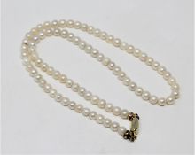 A continental cultured pearl necklace on 14ct gold clasp, length 36cm.