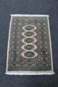 A Bokhara rug on beige ground,