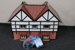 A mid 20th century doll's house and furniture