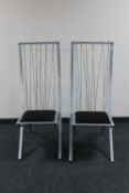 A pair of contemporary metal high backed dining chairs