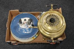 A box of two pottery chargers, two GDR figures,