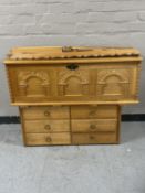 A blond carved oak blanket chest together with an oak six drawer chest