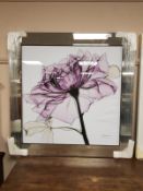 All glass framed picture depicting a flower,