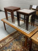 A mid twentieth century Danish tiled coffee table together with a nest of three mahogany tables and