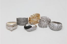Six silver dress rings