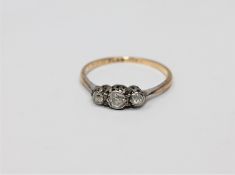 A 9ct gold three stone diamond ring, size P CONDITION REPORT: 1.