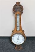 An Edwardian oak aneroid barometer