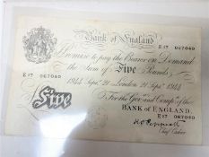 A five pound Bank of England Note no. E17 067040.